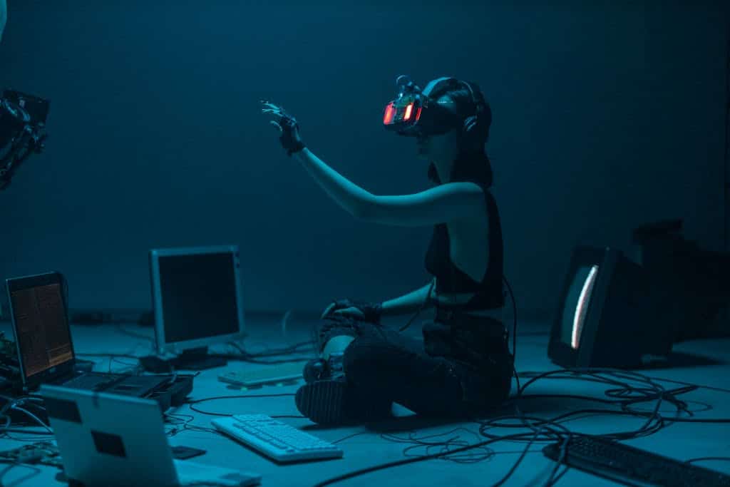 A Woman in a Tank Top Using a VR Headset