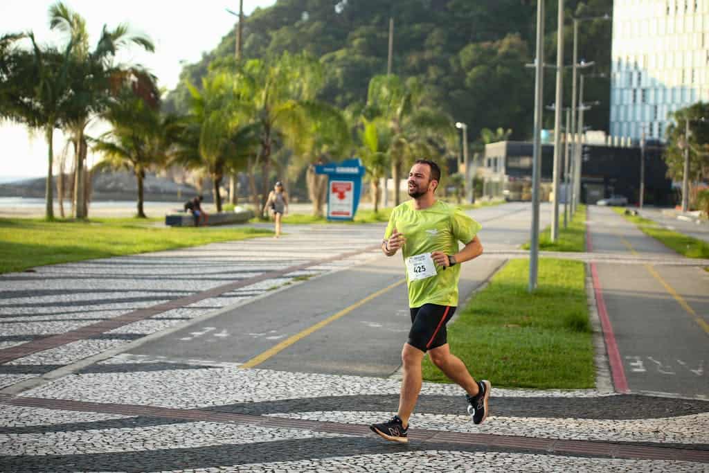 A Man Running on a Street in City