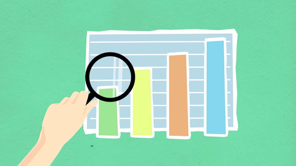 Cutout paper illustration of human hand with magnifier and chart